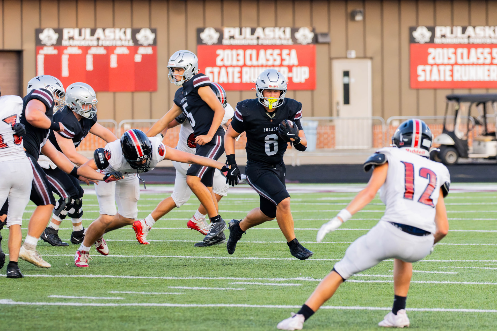 Pulaski County Maroons running back cutting upfield during a home game